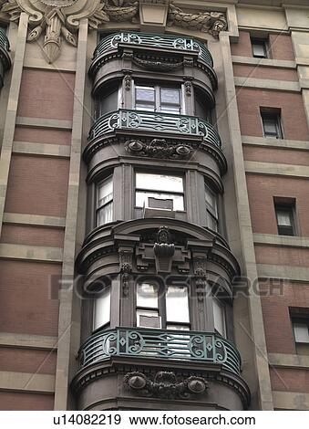 Stock Photo - Ornate bay windows in a building in Manhattan, New York City, U. S. A.. Fotosearch