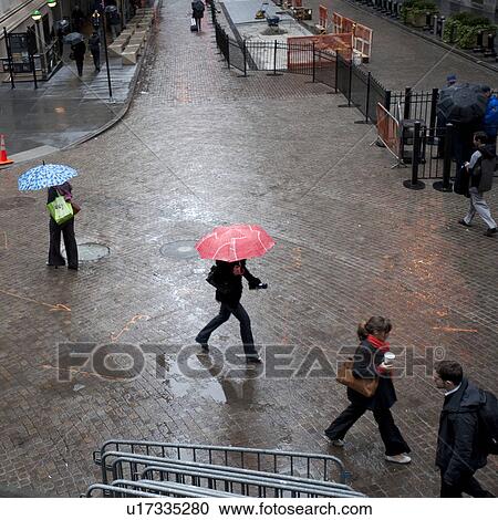 Overview of people walking with umbrellas in Manhattan, New York City, U. S. A. View Large Photo Image Stock Image - Overview of people walking with umbrellas in Manhattan, New York City, U. S. A.. Fotosearch