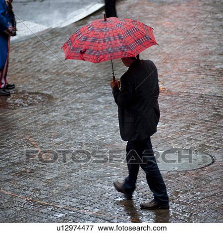 Overview Of People Walking With Umbrellas In Manhattan New York