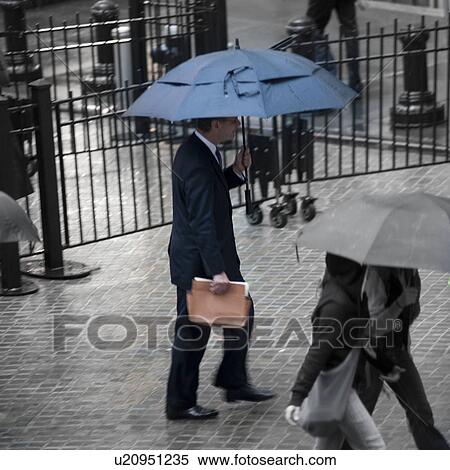 Overview of people walking with umbrellas in Manhattan, New York City, U. S. A. View Large Photo Image Stock Photography - Overview of people walking with umbrellas in Manhattan, New York City, U. S. A.. Fotosearch