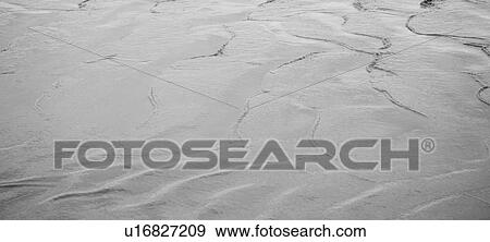 Stock Photo - Pattern in sand on shoreline in Bali. Fotosearch