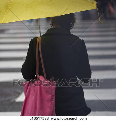 Pedestrians walking with umbrellas in Manhattan, New York City, U. S. A. View Large Photo Image Stock Image - Pedestrians walking with umbrellas in Manhattan, New York City, U. S. A.. Fotosearch