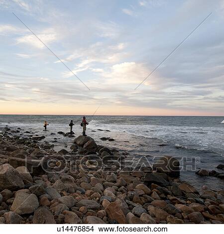 People fishing off the Hampton shoreline View Large Photo Image Picture - People fishing off the Hampton shoreline. Fotosearch