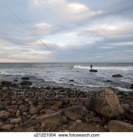 People fishing off the Hampton shoreline View Large Photo Image Picture - People fishing off the Hampton shoreline. Fotosearch
