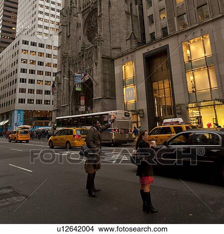 People hailing a cab on Fifth Avenue in Manhattan, New York City, U. S. A. View Large Photo Image Picture - People hailing a cab on Fifth Avenue in Manhattan, New York City, U. S. A.. Fotosearch