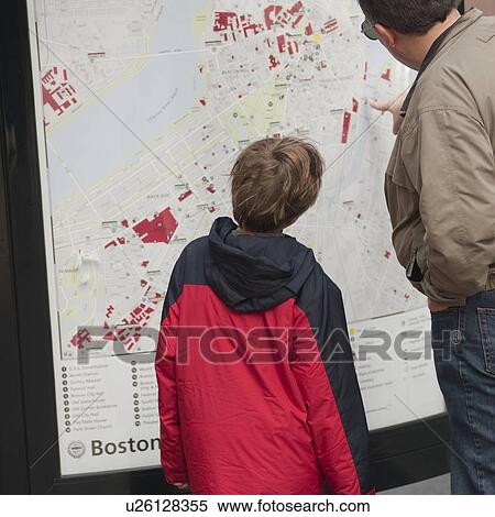 Stock Photography - People looking at a map in Boston, Massachusetts, USA. Fotosearch