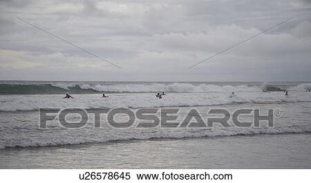 People swimming by shoreline in Bali View Large Photo Image Stock Photography - People swimming by shoreline in Bali. Fotosearch
