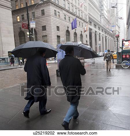 People walking in the rain in Manhattan, New York City, U. S. A. View Large Photo Image Stock Image - People walking in the rain in Manhattan, New York City, U. S. A.. Fotosearch