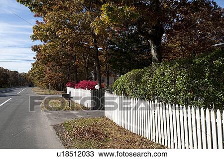 Stock Image - Picket fence in East Hamptons. Fotosearch