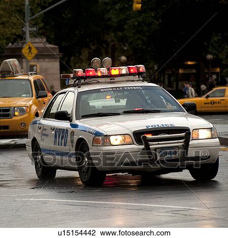 Stock Image - Police vehicle on the streets of Manhattan, New York City, U. S. A.. Fotosearch