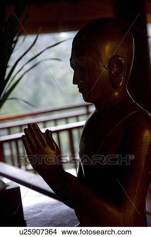 Praying Buddha statue in Bali View Large Photo Image Picture - Praying Buddha statue in Bali. Fotosearch