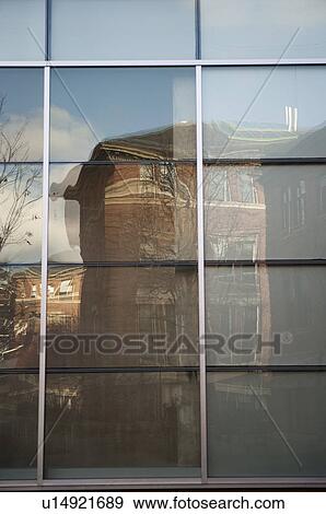 Stock Photo - Reflection in a window on Harvard University campus in Boston, Massachusetts, USA. Fotosearch