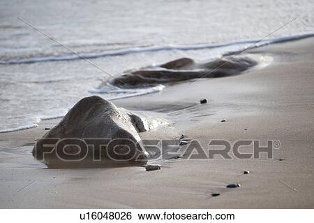 Stock Photograph - Rocks on the Hampton seashore. Fotosearch