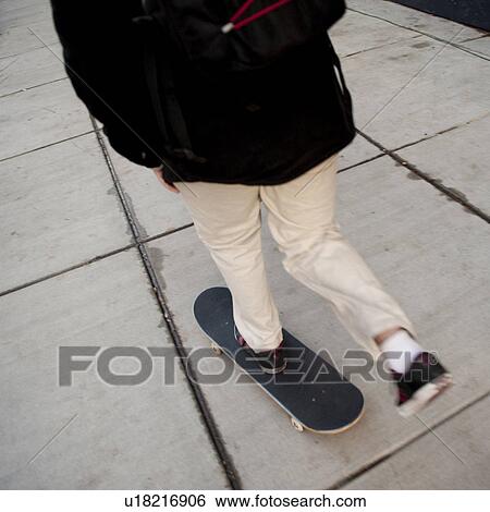 Stock Photograph - Skateboard on sidewalk in Boston, Massachusetts, USA. Fotosearch