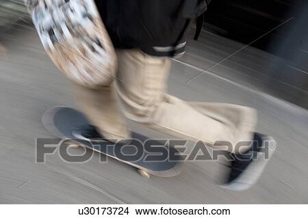Skateboarder in Boston, Massachusetts, USA View Large Photo Image Picture - Skateboarder in Boston, Massachusetts, USA. Fotosearch