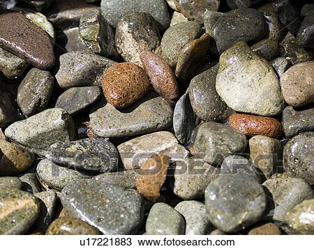 Stock Image - Smalled coloured rocks. Fotosearch