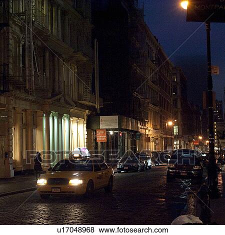 Stock Photo - Street at night in Manhattan, New York City, U. S. A.. Fotosearch