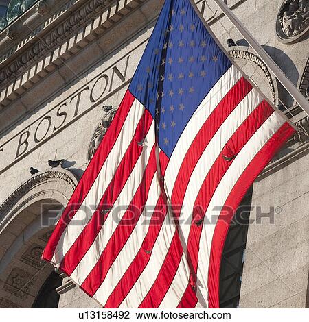 Stock Image - The American Flag on the exterior of a building in Boston, Massachusetts, USA. Fotosearch