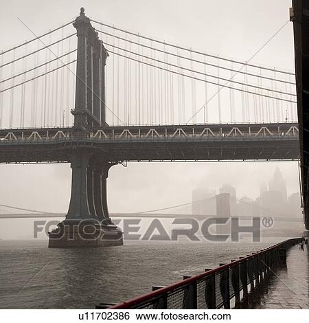 Stock Photograph - View of the Manhattan Bridge in Manhattan, New York City, U. S. A.. Fotosearch
