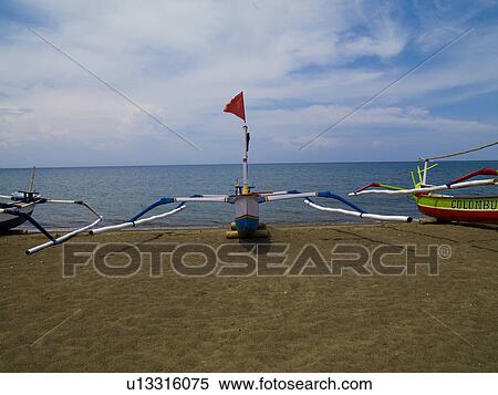 Stock Photography - Watercraft on beach in Bali. Fotosearch