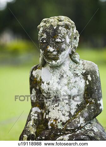 Stock Photo - Weathered statue in Bali. Fotosearch