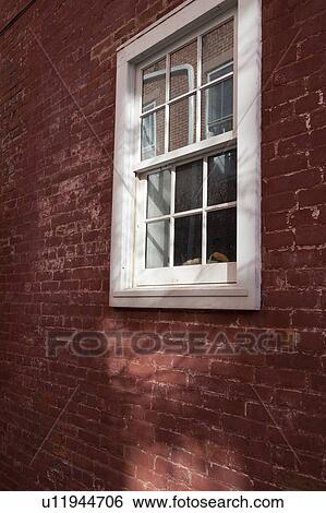Stock Photograph - Windows and brick exterior of a building in the Hamptons. Fotosearch