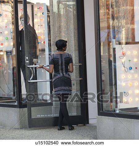 Woman standing in doorway of a store in Boston, Massachusetts, USA View Large Photo Image Stock Image - Woman standing in doorway of a store in Boston, Massachusetts, USA. Fotosearch