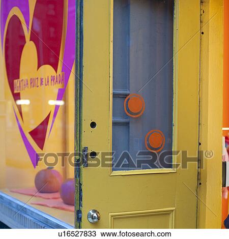 Stock Image - Yellow door in Manhattan, New York City, U. S. A.. Fotosearch