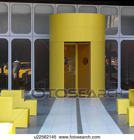 Stock Photography - Yellow doorway entrance to the Standard Hotel in Manhattan, New York City, U. S. A.. Fotosearch