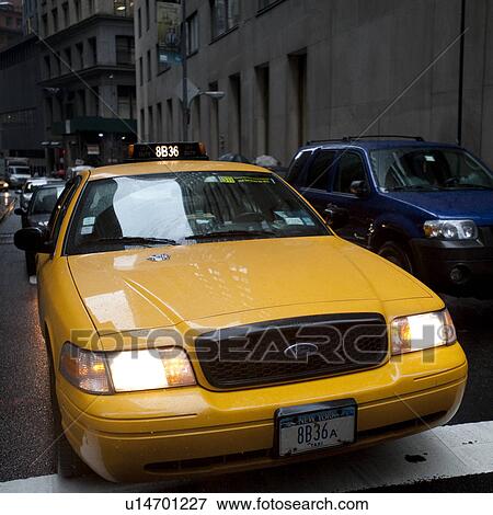 Yellow taxi in Manhattan, New York City, U. S. A. View Large Photo Image Stock Photo - Yellow taxi in Manhattan, New York City, U. S. A.. Fotosearch