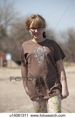 Stock Image - Young girl on beach in Winnipeg Beach, Manitoba, Canada. Fotosearch