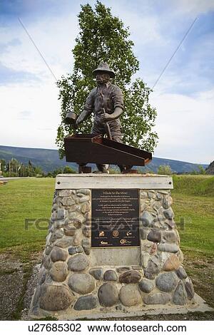 Stock Image - monument of miner george washington carmack; dawson city, yukon territory, canada. Fotosearch