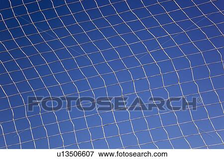 pattern created by string netting against a blue sky View Large Photo Image Stock Photo - pattern created by string netting against a blue sky. Fotosearch