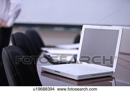 A laptop on the conference table View Large Photo Image Picture - A laptop on the conference table. Fotosearch