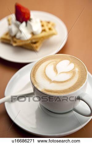 Afternoon tea, A cup of cappuccino and dessert on the saucer View Large Photo Image Stock Image - Afternoon tea, A cup of cappuccino and dessert on the saucer. Fotosearch
