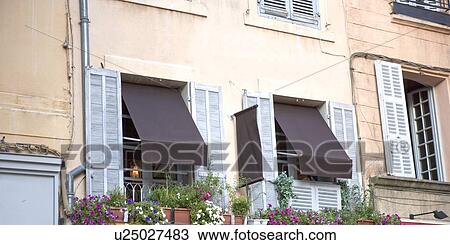 Stock Image - Beautiful windows at Aix-en-Provence, France. Fotosearch