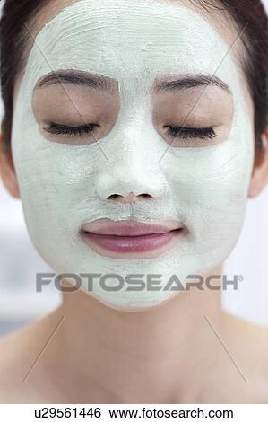 Beauty Treatment, Close-up of woman's face applying with lotion View Large Photo Image Stock Photograph - Beauty Treatment, Close-up of woman's face applying with lotion. Fotosearch