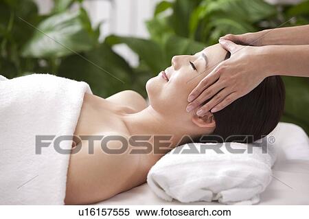 Beauty Treatment, Woman lying and enjoying massaging View Large Photo Image Stock Photography - Beauty Treatment, Woman lying and enjoying massaging. Fotosearch