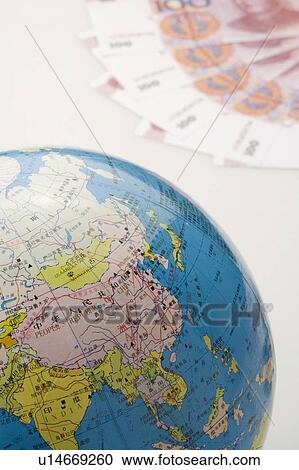 Chinese Currency and a globe View Large Photo Image Stock Image - Chinese Currency and a globe. Fotosearch