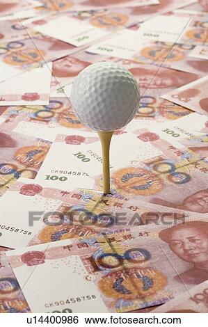Chinese Currency and a golf ball View Large Photo Image Stock Photograph - Chinese Currency and a golf ball. Fotosearch