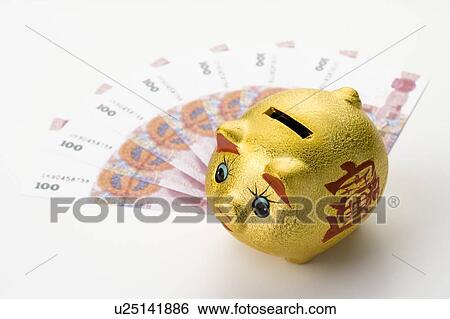 Chinese Currency and a piggy bank View Large Photo Image Stock Photograph - Chinese Currency and a piggy bank. Fotosearch