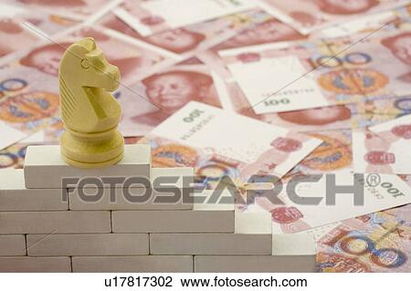 Stock Image - Chinese Currency, chess on blocks. Fotosearch