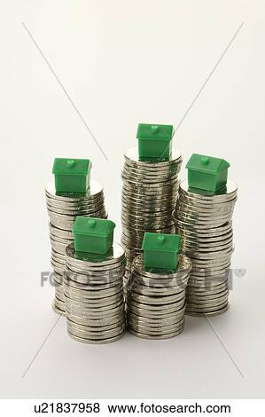 Stock Photo - Chinese Currency, model houses placed on top of stacks of coins. Fotosearch