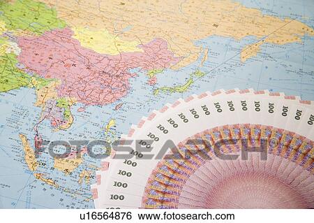 Chinese Currency on world map View Large Photo Image Stock Photograph - Chinese Currency on world map. Fotosearch