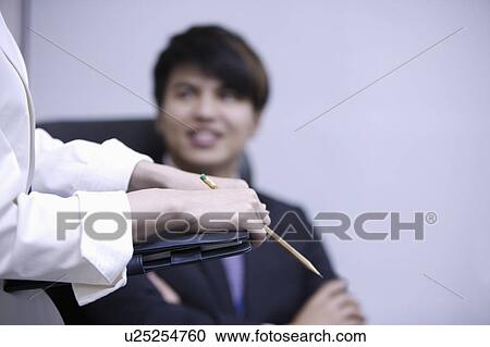 Close-up hands holding a pencil and document folder View Large Photo Image Stock Image - Close-up hands holding a pencil and document folder. Fotosearch