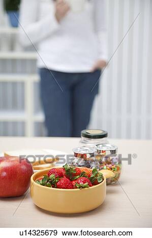 Stock Photo - Close-up of fruits and desserts on the table. Fotosearch