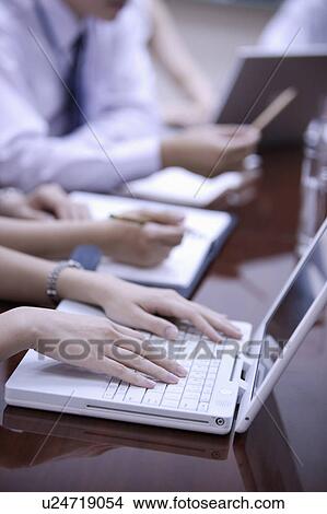 Close-up of hands using laptop View Large Photo Image Picture - Close-up of hands using laptop. Fotosearch