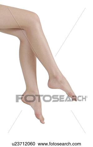 Stock Image - Close-up of young woman's legs. Fotosearch