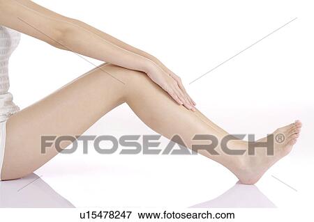 Stock Photo - Close-up of young woman's legs. Fotosearch
