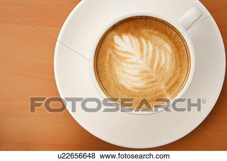 Stock Photo - Coffee, Close-up of a cup of cappuccino with pattern. Fotosearch